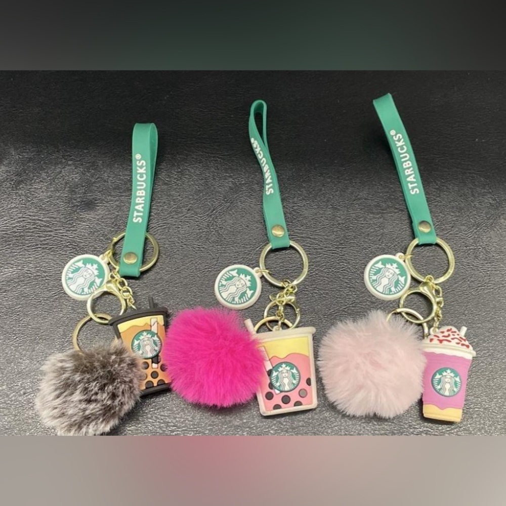 Three Starbucks Refreshers Keychains with Pink and Gray Pom Poms